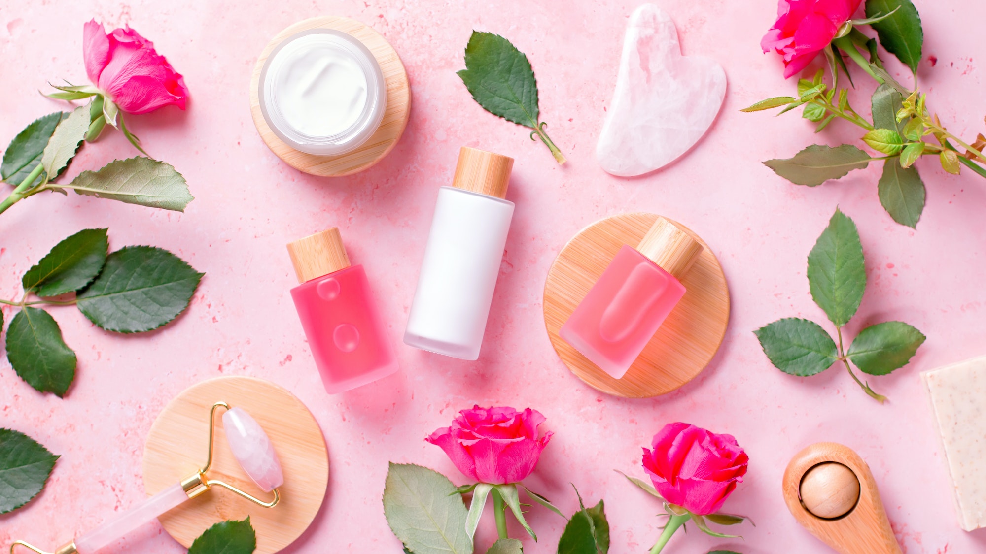Plastic free composition with beauty products and beauty accessories on pink
